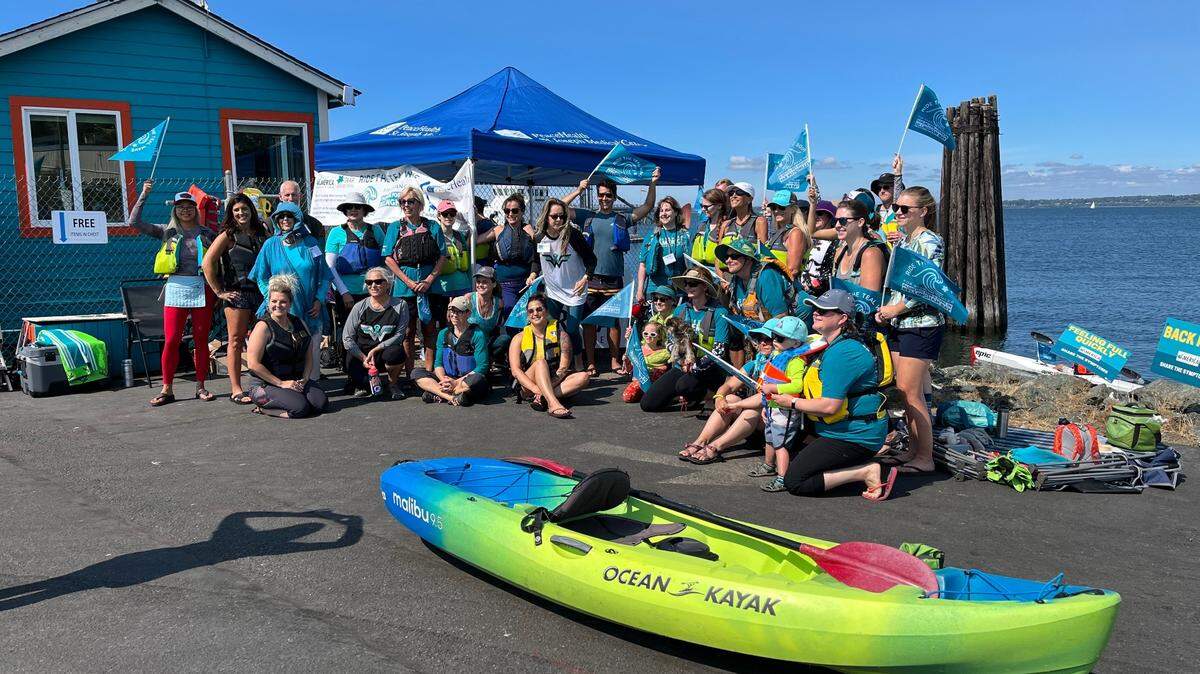 Members of the ovarian cancer community gathered on Sept. 3, 2022, for the first-ever ‘Ride the Teal Wave’ paddle fundraiser event in Bellingham Bay. The group will gather for its second annual fundraiser event on Sept. 3, 2023.