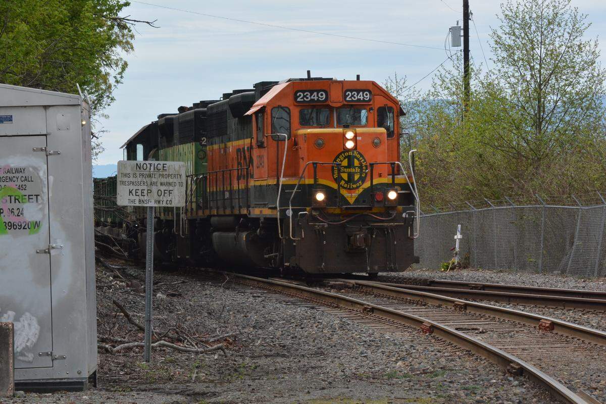 A BNSF freight train heads toward downtown Bellingham along the waterfront at Wharf Street in this file photo.