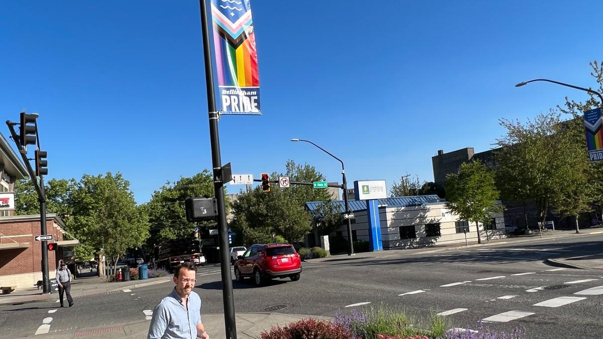 A pride banner flies from a pole at State and Holly streets in downtown Bellingham on June 7. The banners were designed by Bradley James Lockhart, creator of the official city flag.