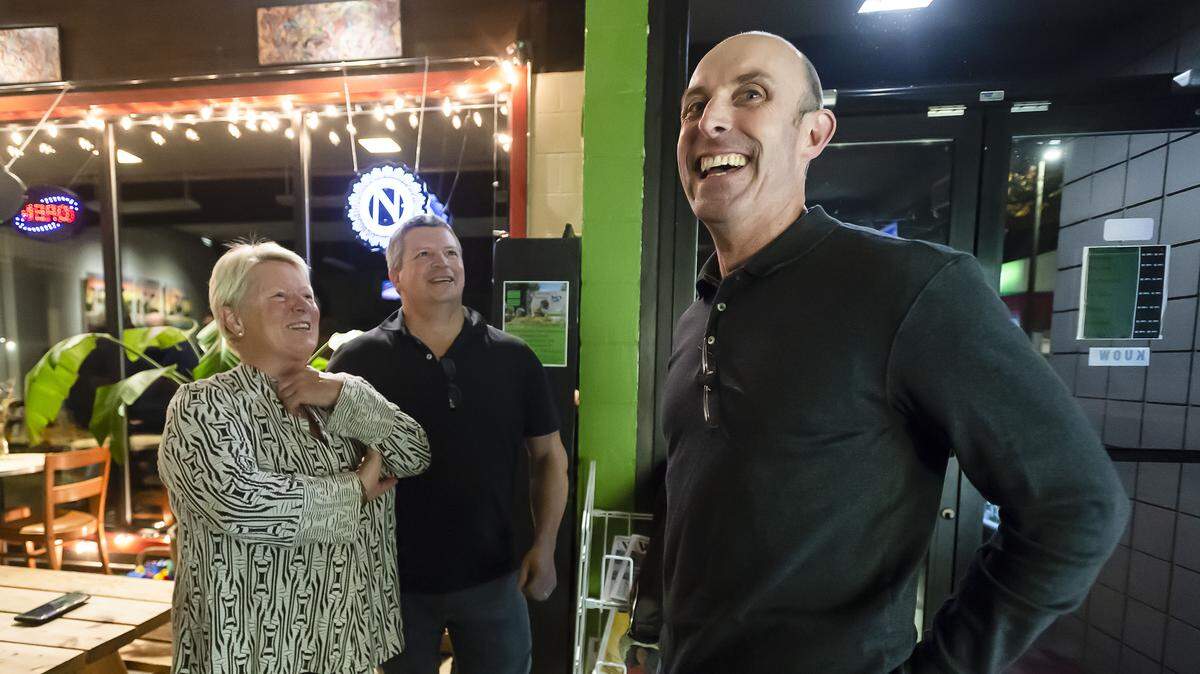Wendy Setter of Bellingham, left, chats with Whatcom County prosecutor candidate Eric Richey, right, while waiting for the results of the 2018 midterm elections in Whatcom County on Tuesday evening at Green’s Corner in Bellingham.