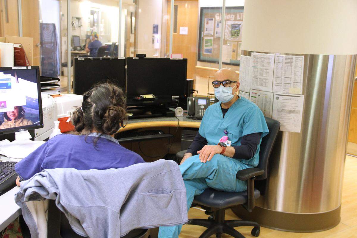 Dr. Raj Deol talks with a nurse in the intensive care unit at St. Joseph hospital in Bellingham, in March 2021. At the time, a COVID-19 surge was keeping the hospital extremely busy. PeaceHealth Northwest Regional Chief Medical Officer Dr. Sudhakar Karlapudi said in July 2022 that the hospital has seen “historically high” patient volumes in recent weeks with patients who have not properly cared for chronic diseases due to COVID-19 and patients with new diagnoses of cancer or other chronic diseases from the past two-plus years.