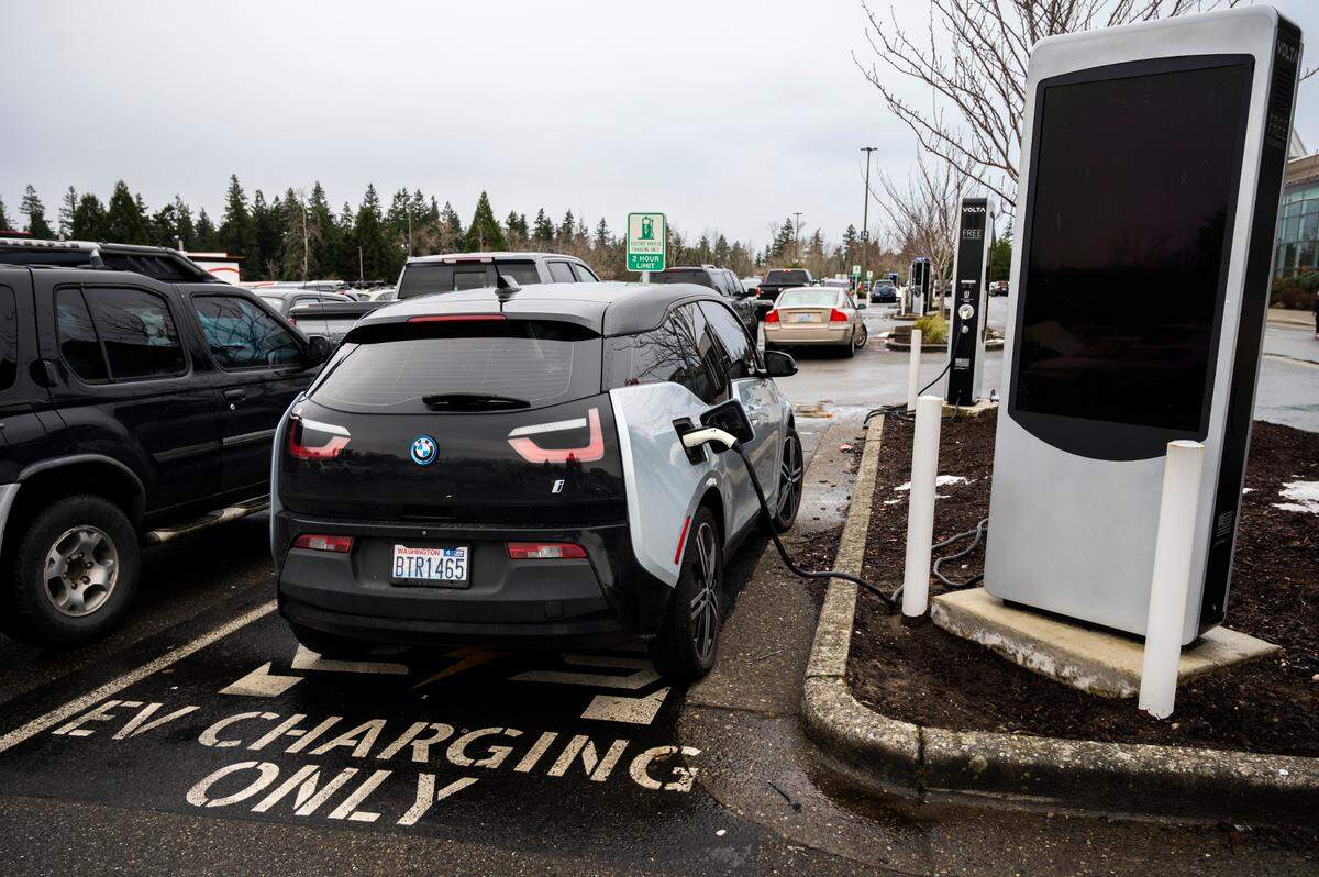 An electric car uses one several free charging stations at the Bellis Fair Mall on Friday, Jan. 7, in Bellingham. Washington state could see an estimated $5.9 billion in public health benefits by 2050 if it can eliminate planet-warming pollution from cars, trucks and buses, according to an American Lung Association report published Wednesday, March 30.