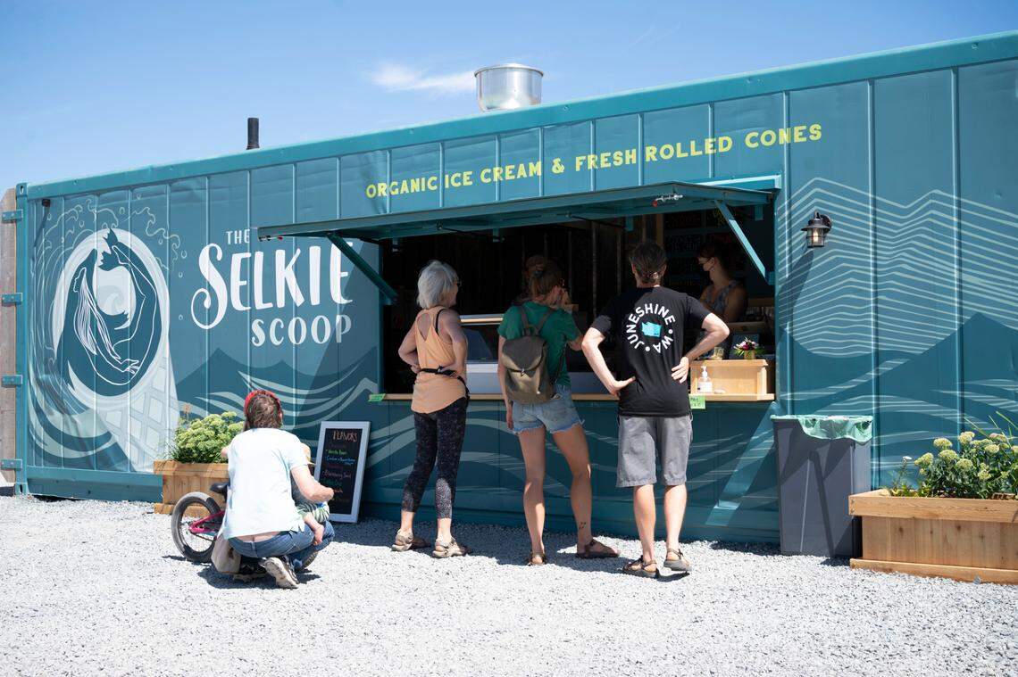 People stop for a treat at The Selkie Scoop near Kulshan’s Trackside Beer Garden on the waterfront on Thursday, Aug. 5, 2021, in Bellingham, Wash.