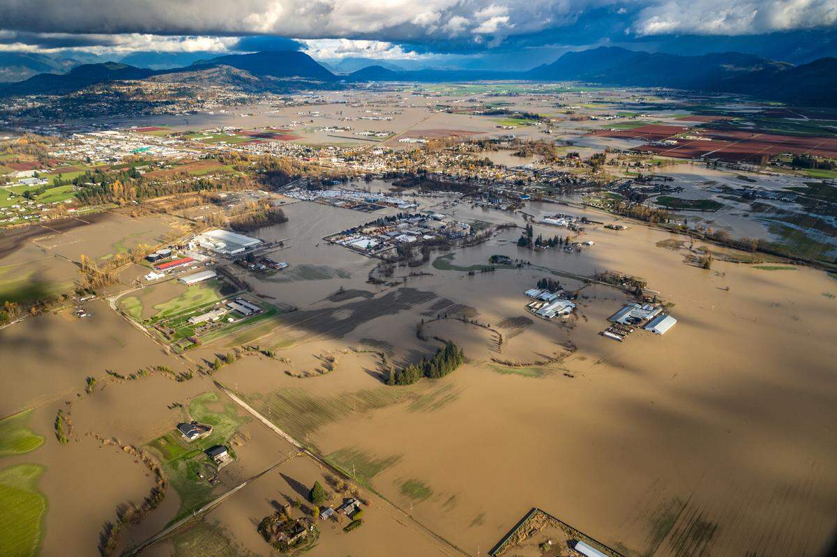 An aerial view of Sumas looking northeast up the Frasier River Valley shows the impact of river flooding on Tuesday, Nov. 17. Officials were hopeful that a low tide overnight would drain the last of the deluge, which forced more than 500 people from their homes and closed hundreds of roads in Whatcom County.