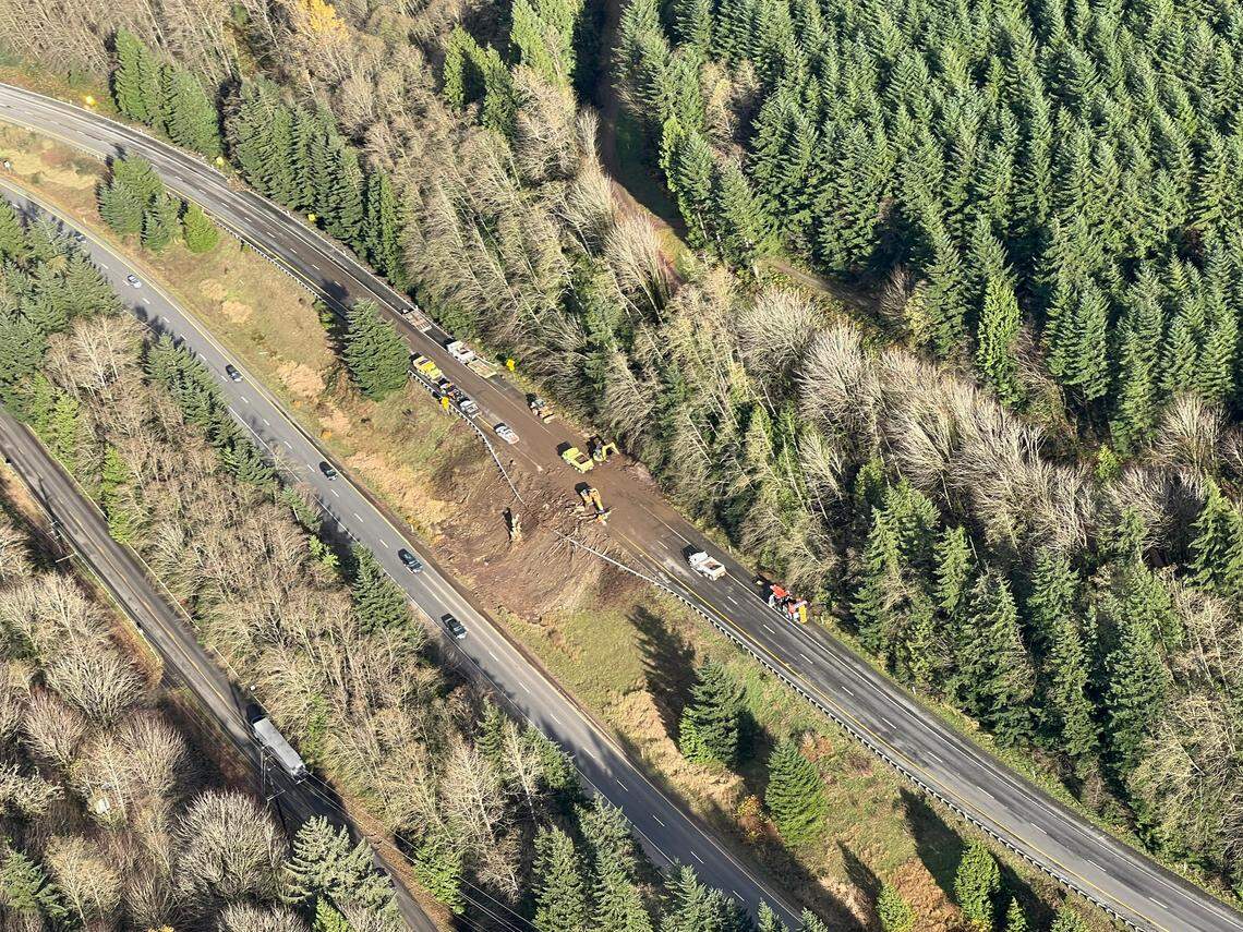State crews work Tuesday afternoon, Nov. 16, on the slide that had closed northbound Interstate 5 south of Bellingham.