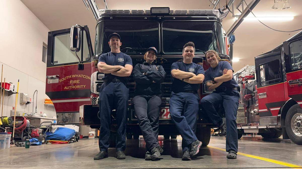 Engine 22’s crew poses for a photo at South Whatcom Fire Station 21 in the Geneva area east of Bellingham, before they left Friday to help fight the wildfires in Southern California. From left are firefighter Sean Hecker, Lt. Jen Squire, and firefighters Ethan Gerard and Annie Leete.