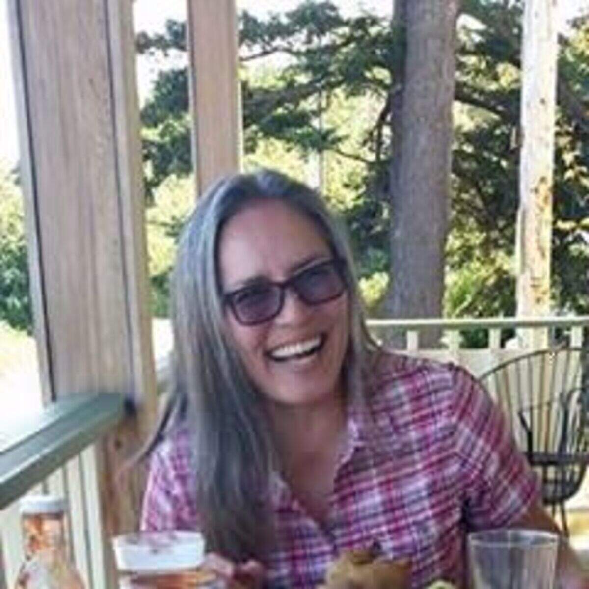 Bellingham Herald reporter Kie Relyea relaxes with a beer, likely from a local brewery.