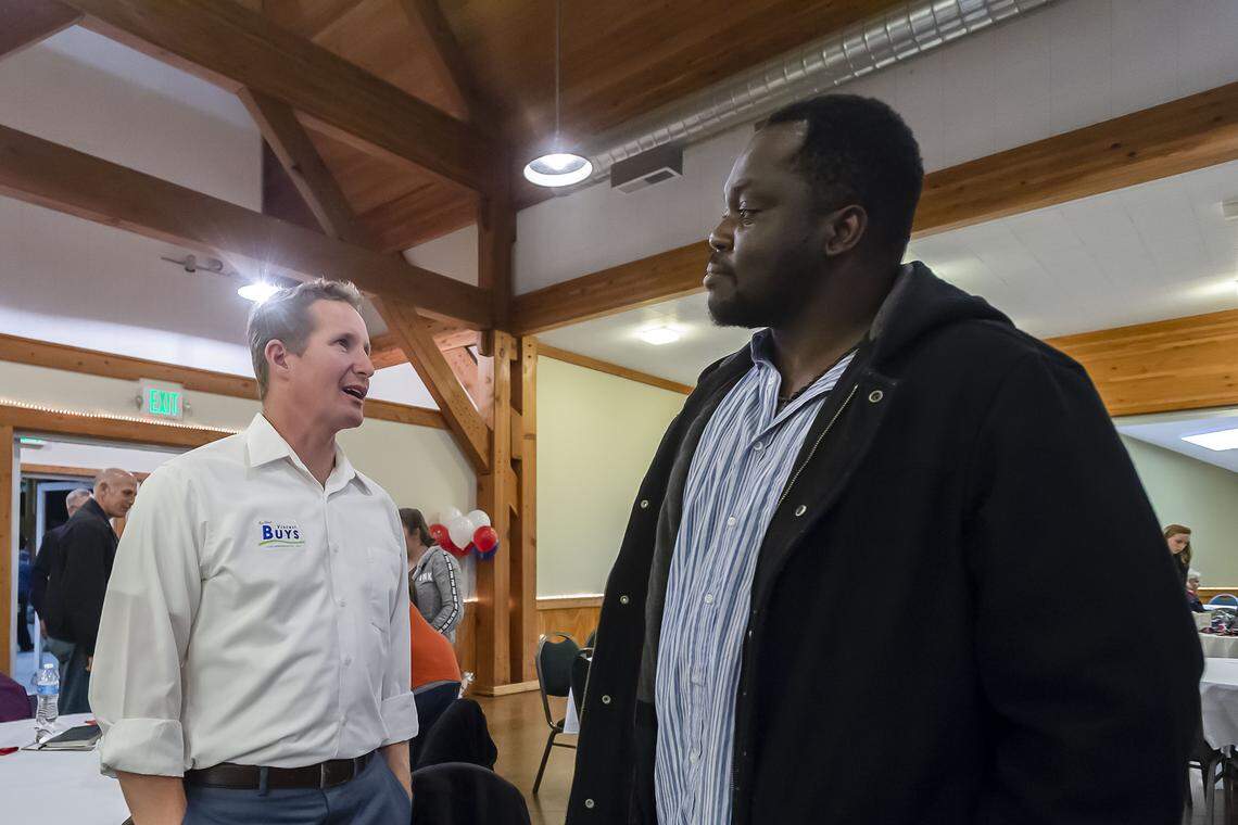Rep. Vincent Buys, left, talks with Manis Pierre as the results of the 2018 midterm elections in Whatcom County roll in on Tuesday evening at the Mount Baker Rotary Building in Lynden, where Whatcom Republicans gathered.
