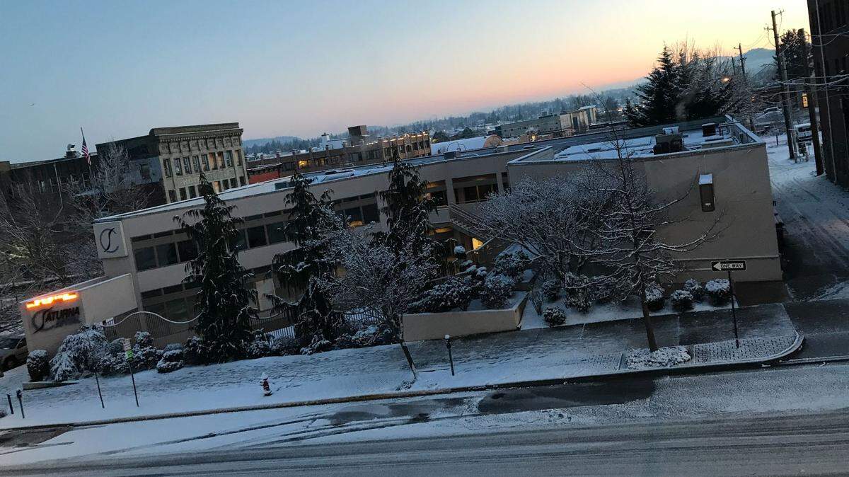 Downtown Bellingham, looking north from State and Holly streets, shows a dusting of snow early Thursday, Feb. 24.