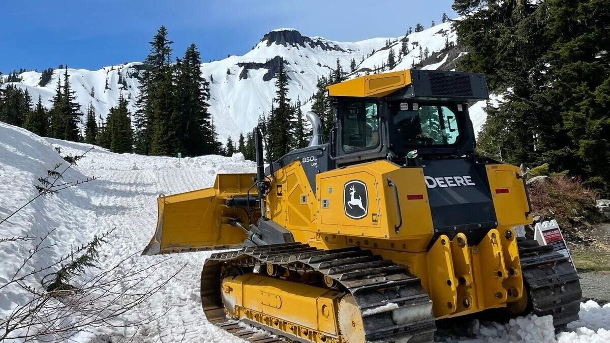 Road-clearing crews with the Washington State Department of Transportation unload bulldozers in the snow near Heather Meadows on June 2, 2025, as clearing efforts started for the road to Artist Point in the Mount Baker-Snoqualmie National Forest east of Bellingham.