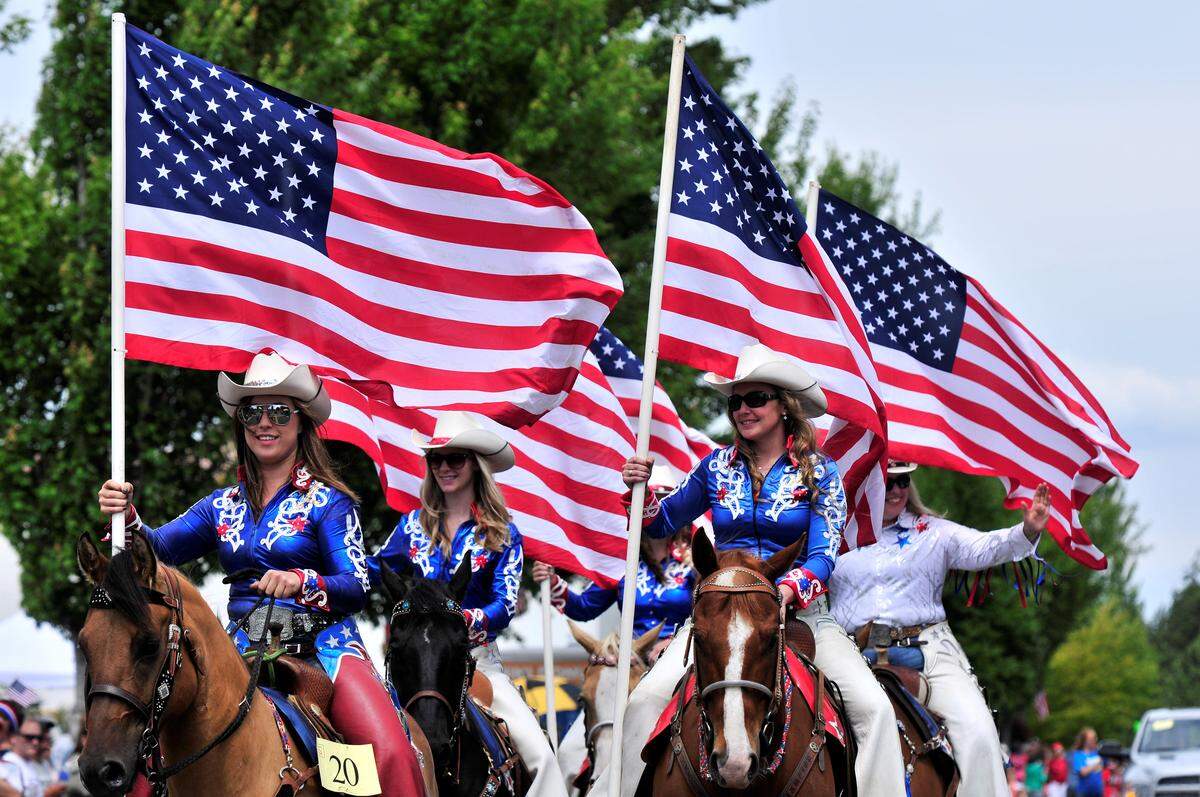 Thousands line Peace Portal Drive to watch almost 100 floats pass by during the 2014 Old Fashioned Fourth of July parade in Downtown Blaine.