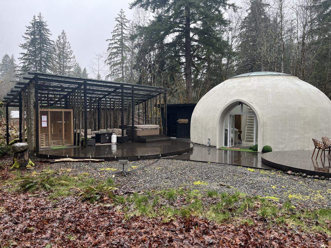 Leaves litter the ground outside of the Skyview Dome on March 11, 2026, in Glacier, Wash. Guests of the Airbnb have access to a sauna, hot tub and two outdoor seating areas.