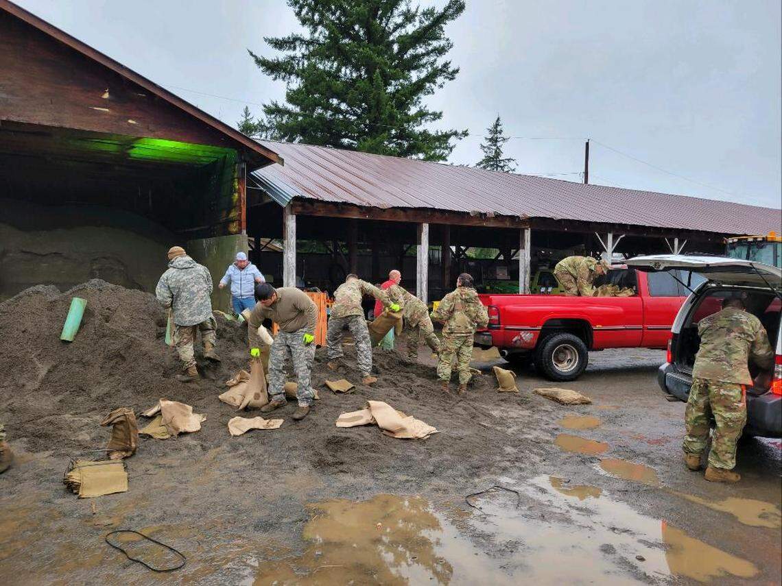 Members of the National Guard stationed in Everson and Sumas in 2021 fill and deliver sandbags in preparation for flooding.