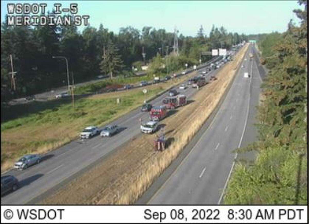 Firetrucks arrive at a wreck in the median of Interstate 5 south of the southbound Meridian Street exit Thursday morning, Sept. 8, in Bellingham.
