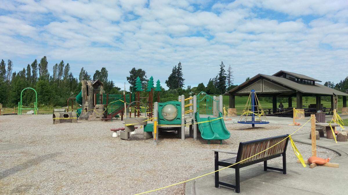Tape remains around the popular Squalicum Creek Park playground in Bellingham on June 17. The city’s playgrounds remain closed during Phase 2 of the state’s “Safe Start” plan to avoid the spread of COVID 19. The parks won’t reopen until Phase 3.