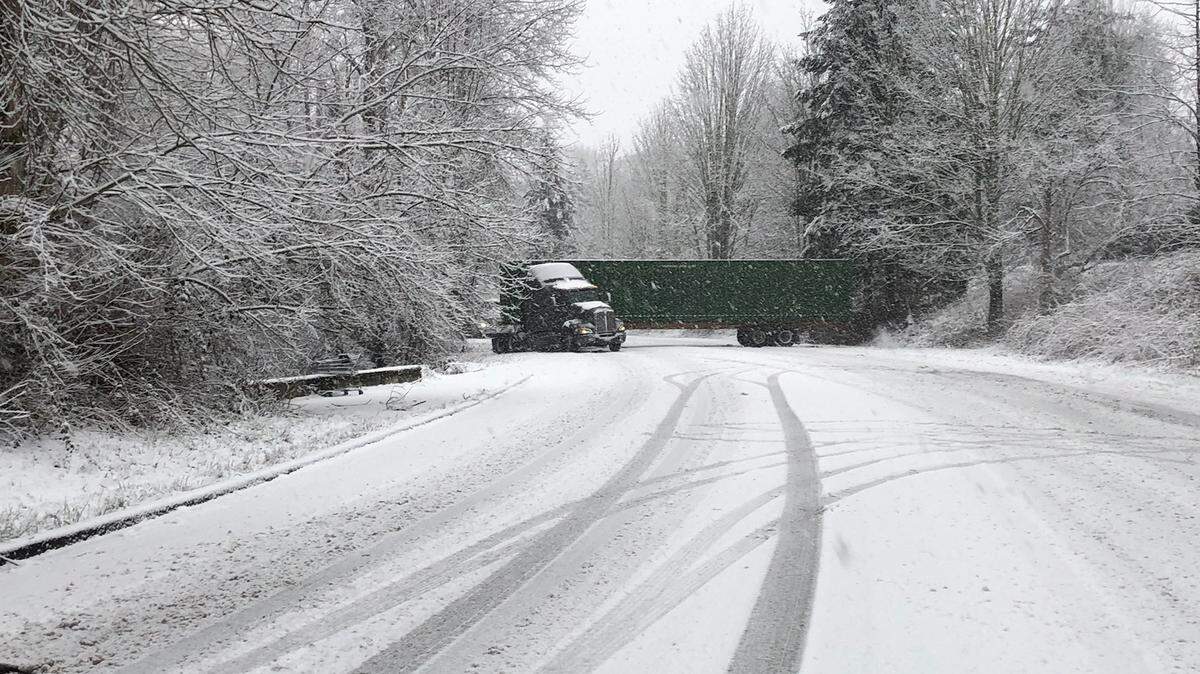 Semi-truck skidded on Squalicum Parkway Tuesday, Feb. 28, during a morning snowstorm in Bellingham. City trucks were on the roads with sand and plows, after pretreating arterials with brine before the snow started.