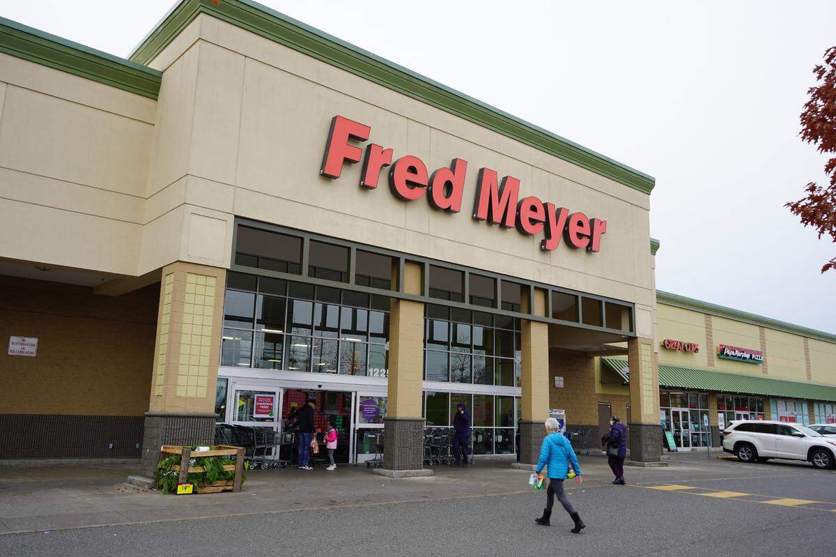 Customers walk into the Fred Meyer grocery store on West Bakerview Road on Friday, Nov. 11, in Bellingham.
