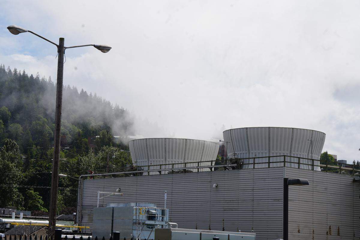 Puget Sound Energy’s Encogen Plant lets off water vapor as a byproduct of its energy production on May 29. A new District Energy system is harvesting the waste heat from the plant to provide hot water and heating for all new buildings on the waterfront.