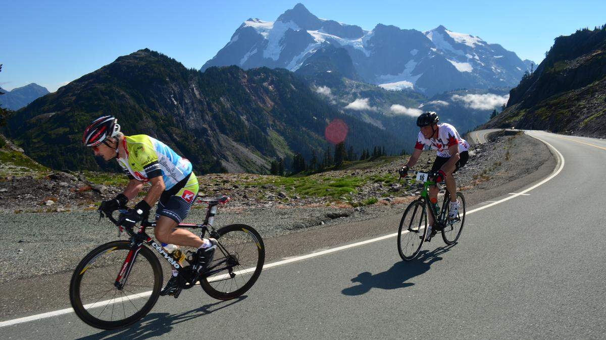 Exhausted riders only yards from the finish line after competing in the grueling Festival 542 in 2013. The Mount Baker Highway will be closed from 7 a.m. to noon Saturday for what is now known as the Mount Baker Hill Climb bicycle race.