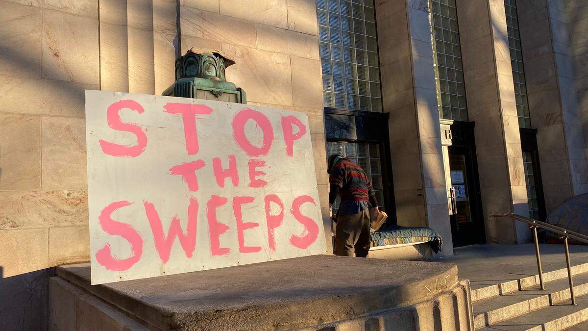 Protesters and homeless advocates blocked Grand Avenue in front of the Whatcom County Courthouse in response to a cleanup of Camp 210 at Bellingham City Hall Friday, Jan. 22, 2021, in Bellingham, Wash.