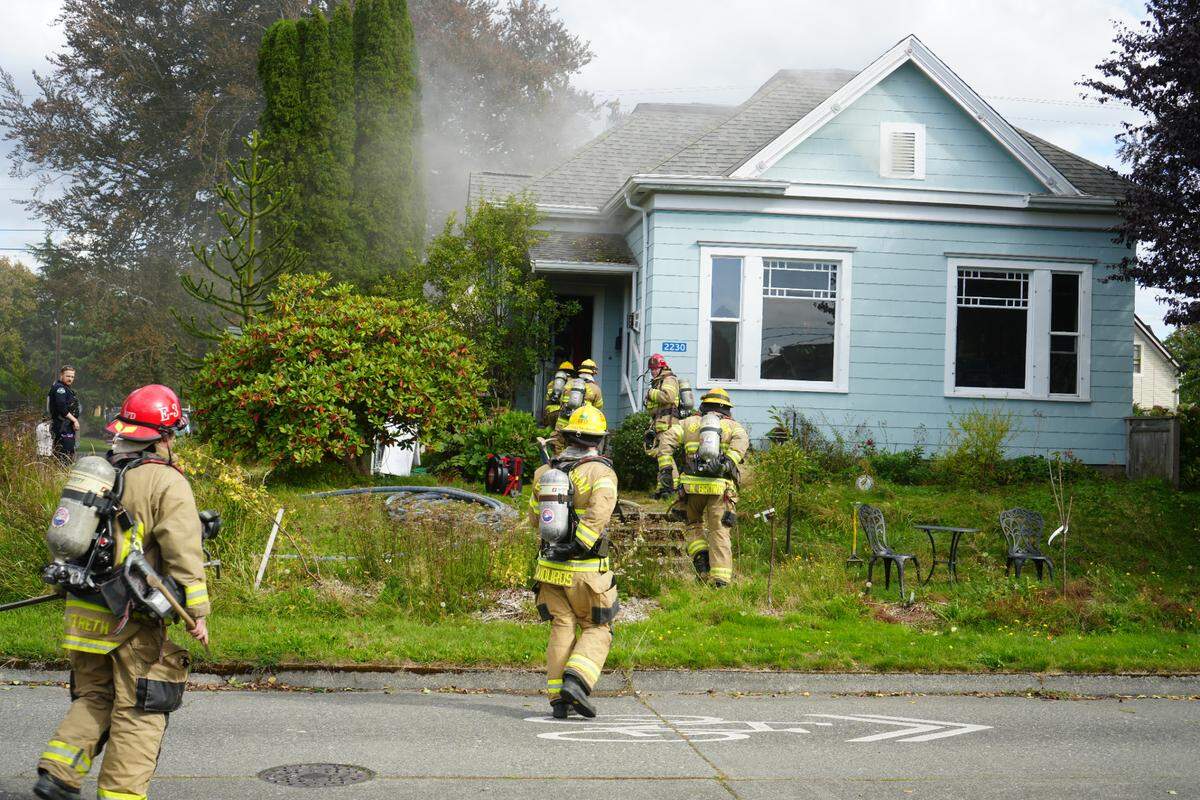 Bellingham Fire Department crews respond to a house fire at 2230 Victor St. on Friday.