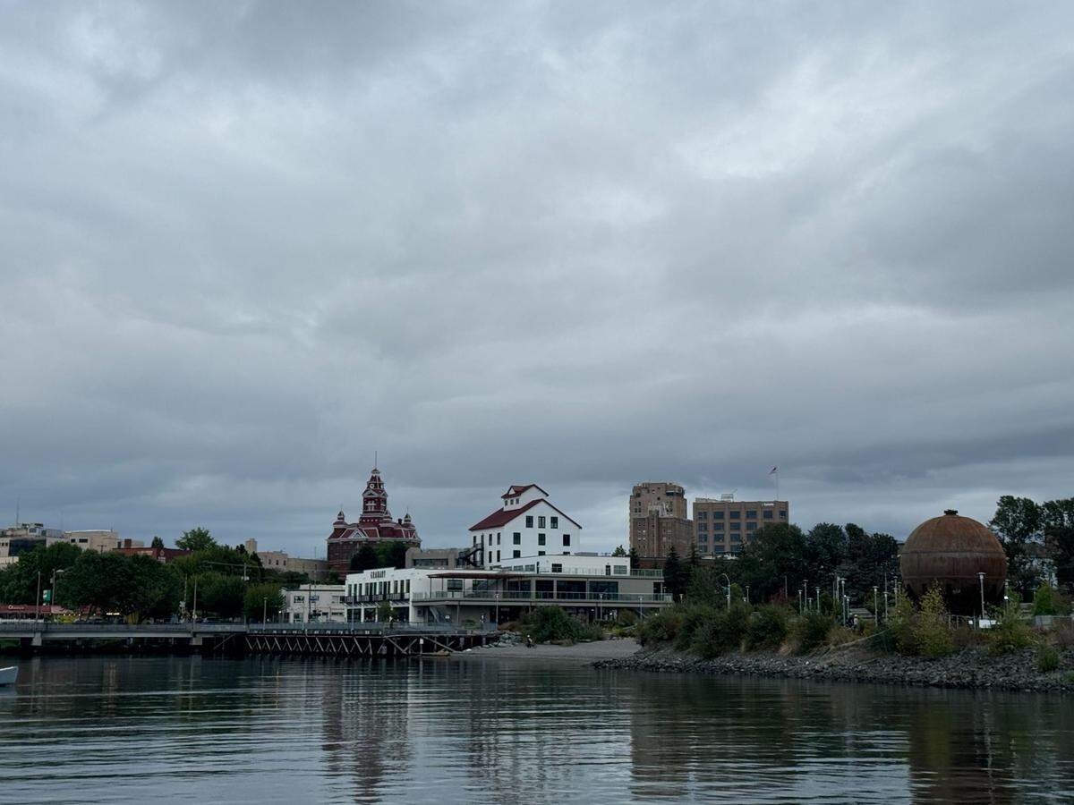 The view of Bellingham’s Granary Building and City Hall from a Whatcom Museum History Sunset Cruise in 2024.