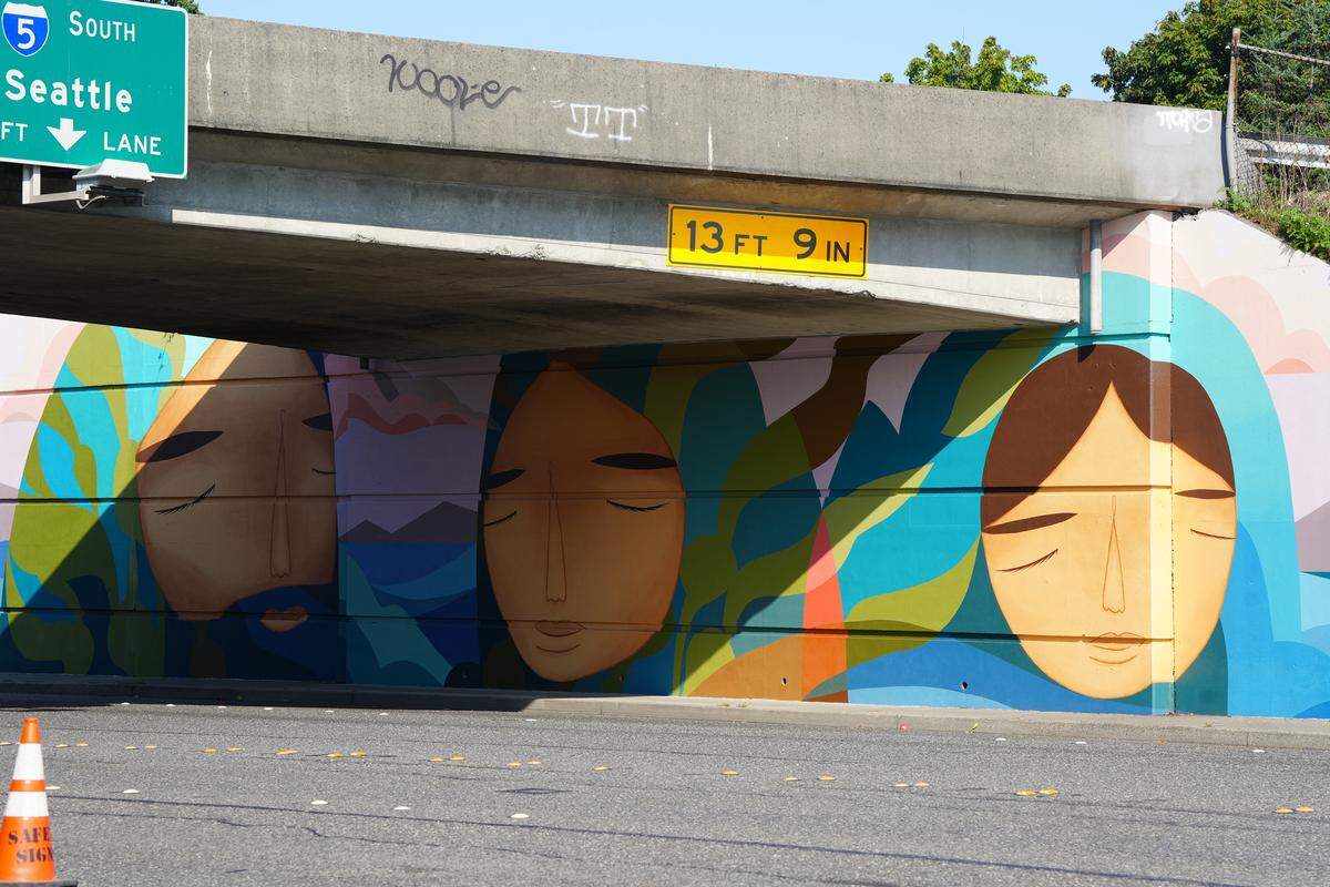 The north side of a mural is complete on Lakeway Drive under the Interstate 5 overpass.