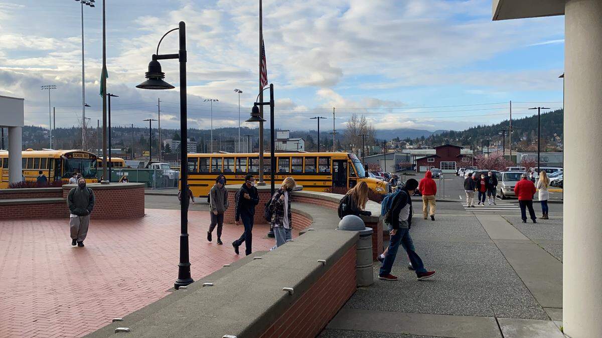 Students approach the front entrance of Bellingham High School on Friday, March 26.