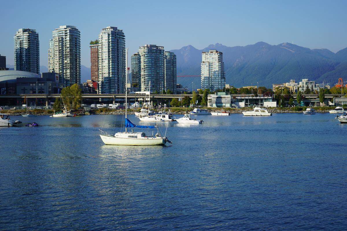 Boats sit in False Creek across from the Olympic Village in Vancouver, B.C., on Monday, Sept. 26.