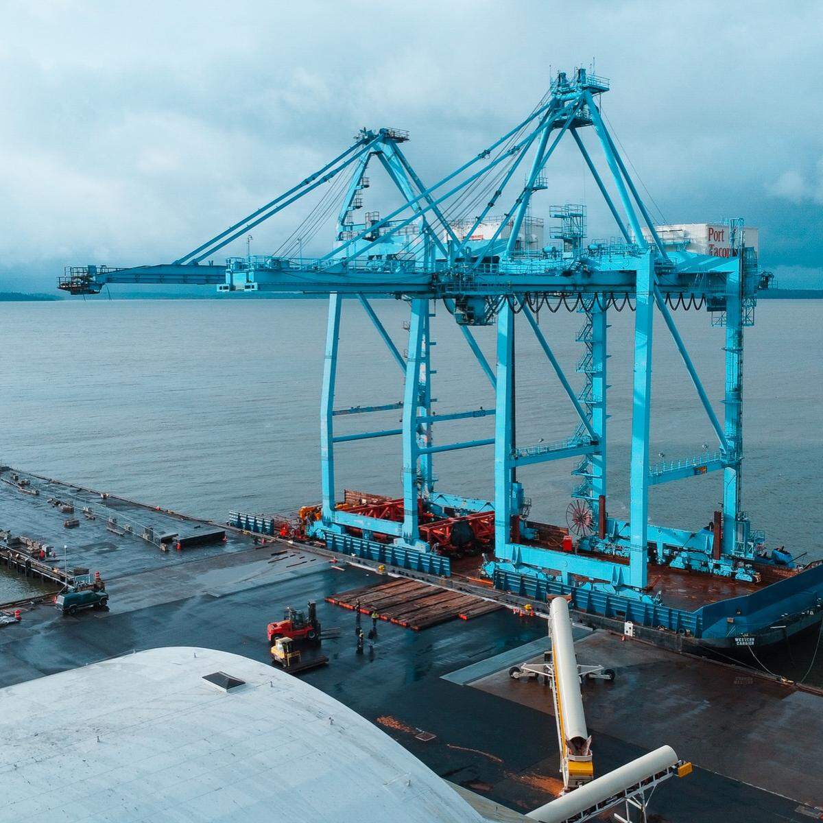 Two large cranes were stored at the Port of Bellingham Shipping Terminal in early 2026. The cranes were transported by barge from the Port of Tacoma and were later disassembled.