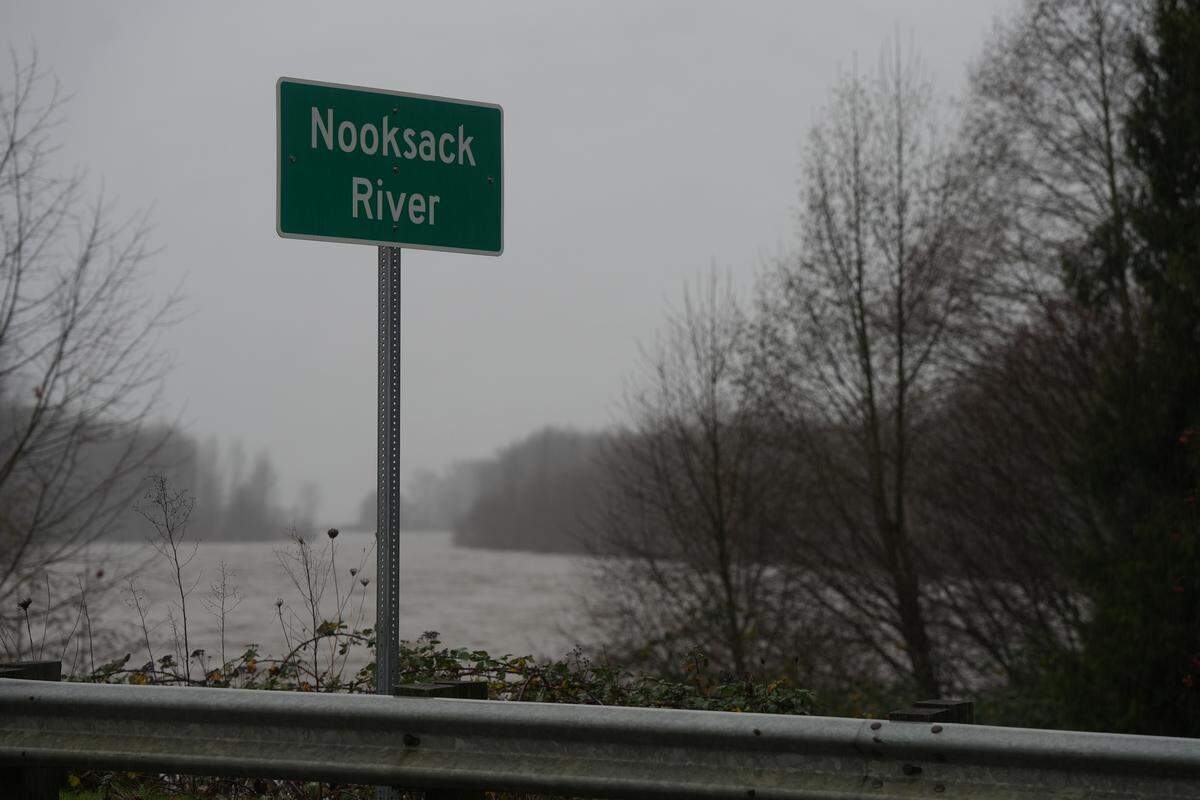 The Nooksack River flows high and fast amid flood warnings on December 10, 2025, in Everson, Wash.