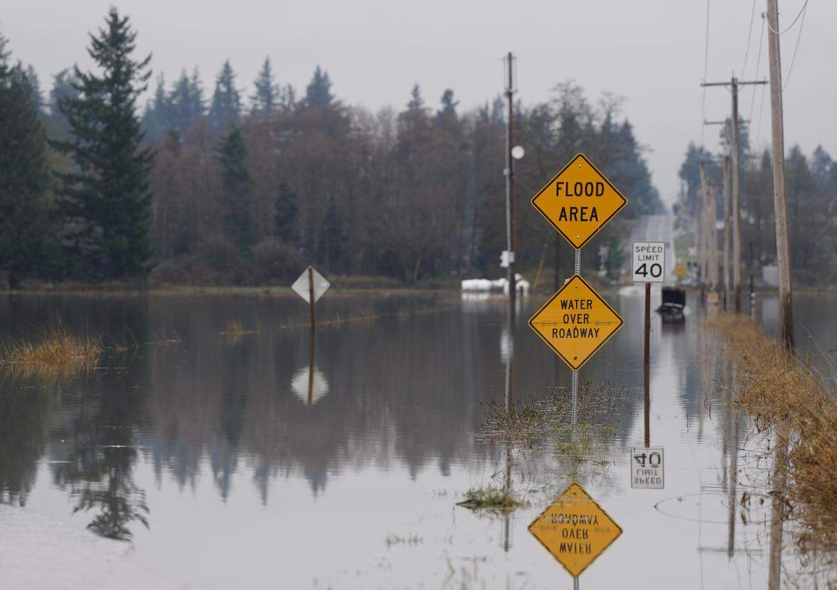 A car was submerged Dec. 12 on Hampton Road east of Lynden after the Nooksack River flooded much of Whatcom County.