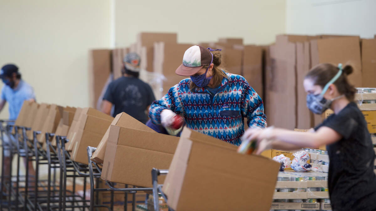 Volunteers package food items at the Bellingham Food Bank in 2020.