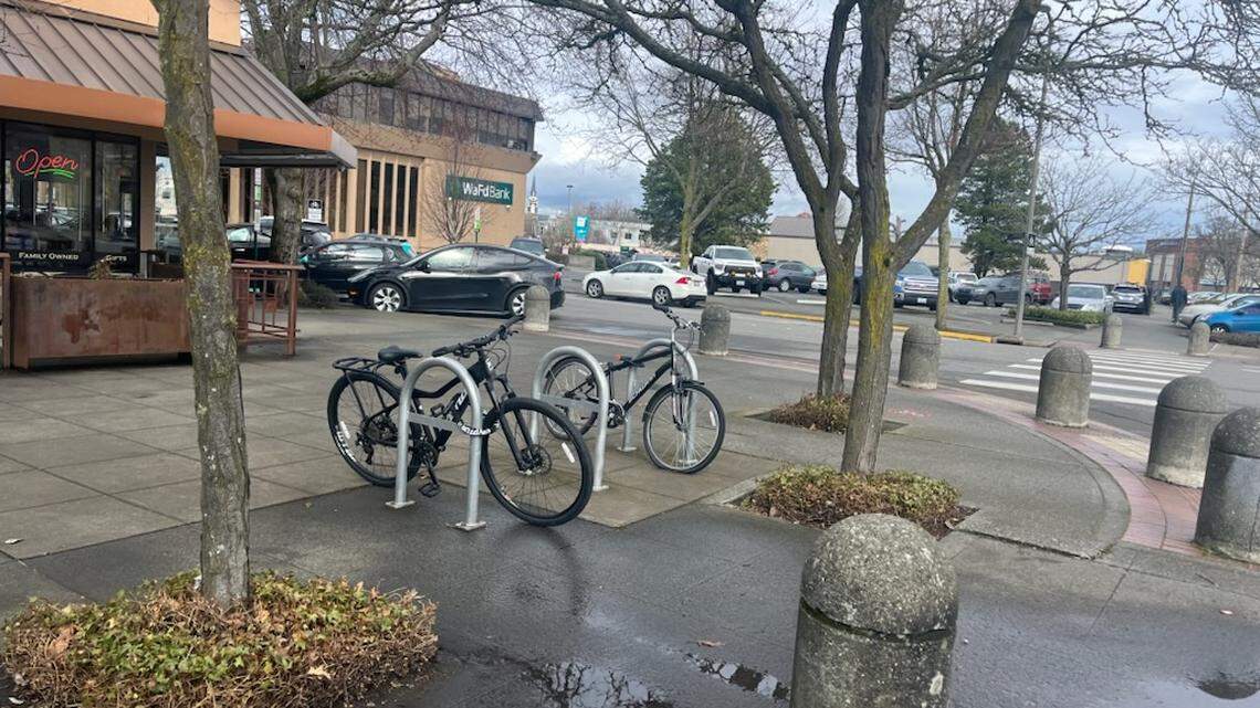 Two locked bikes on the corner of East Champion Street and Railroad Avenue in downtown Bellingham.