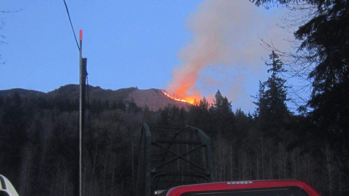 A large wildfire that was visible in parts of Whatcom and Skagit counties burns Wednesday evening, April 15, 2019, an area west of Van Zandt, Washington, near the Middle Fork of the Nooksack River.