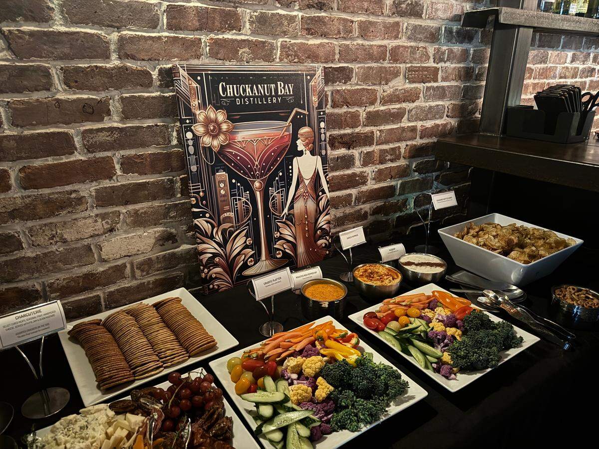 Complimentary charcuterie table at The Pastime speakeasy inside Chuckanut Bay Distillery in Bellingham, Wash. on July 21, 2025.