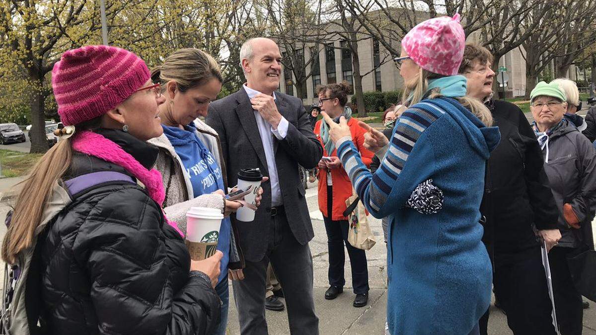 U.S. Rep. Rick Larsen, D-2nd District, center, participates in a May 2022 rally for abortion rights. at the Whatcom County Courthouse.