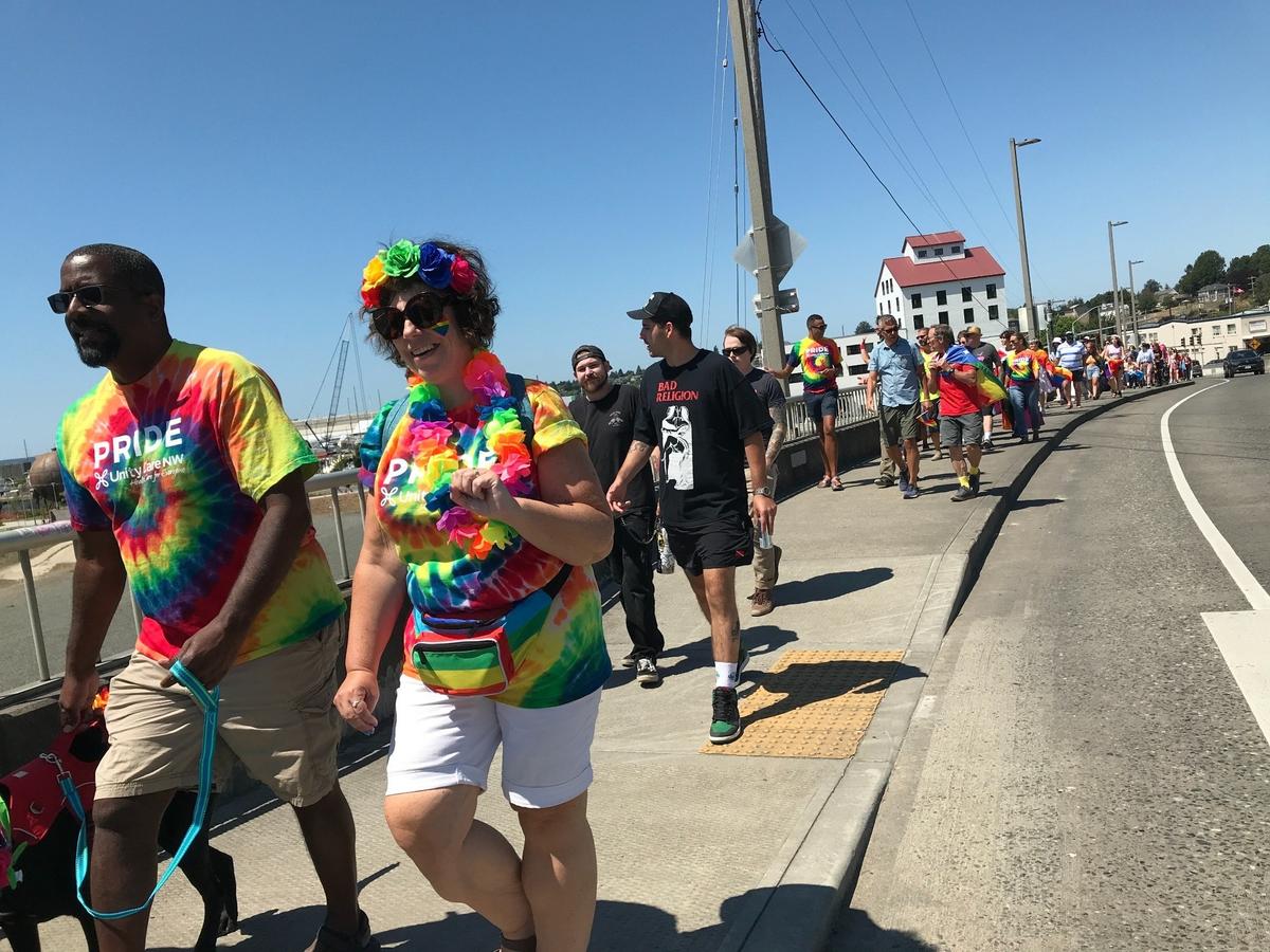 Participants walk along Chestnut Street in Bellingham during the Pop-up Pride Parade on Sunday, July 11, sponsored by Whatcom Pride.
