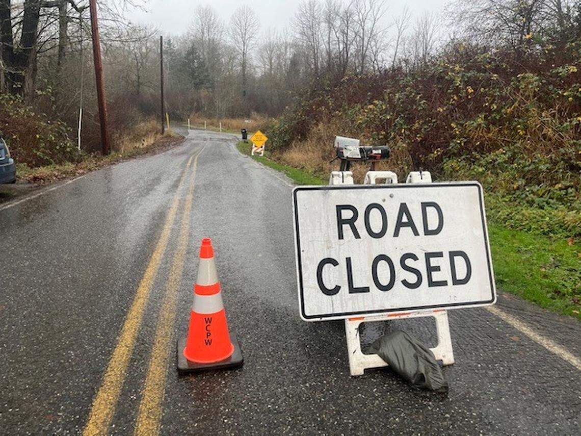 Water was flowing over Bayon Road near Marietta-Alderwood on Wednesday, Dec. 10, 2025, as the county prepared for flooding following several days of heavy rain.
