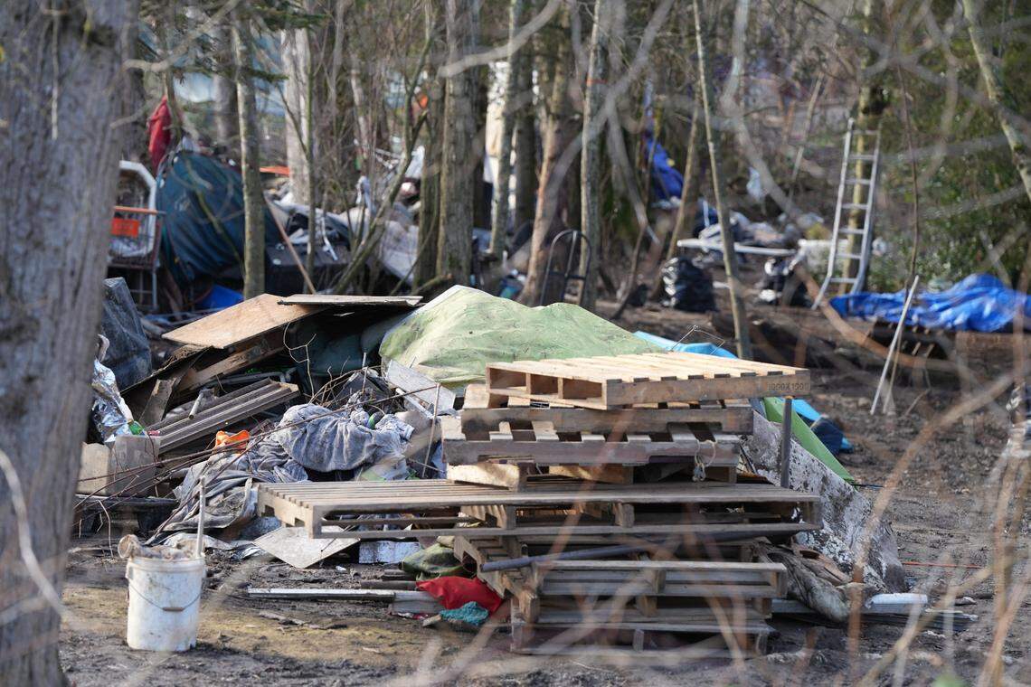Pallets were stacked in a pile as crews worked to clear the encampment on private property on West Bakerview Road and Northwest Drive.