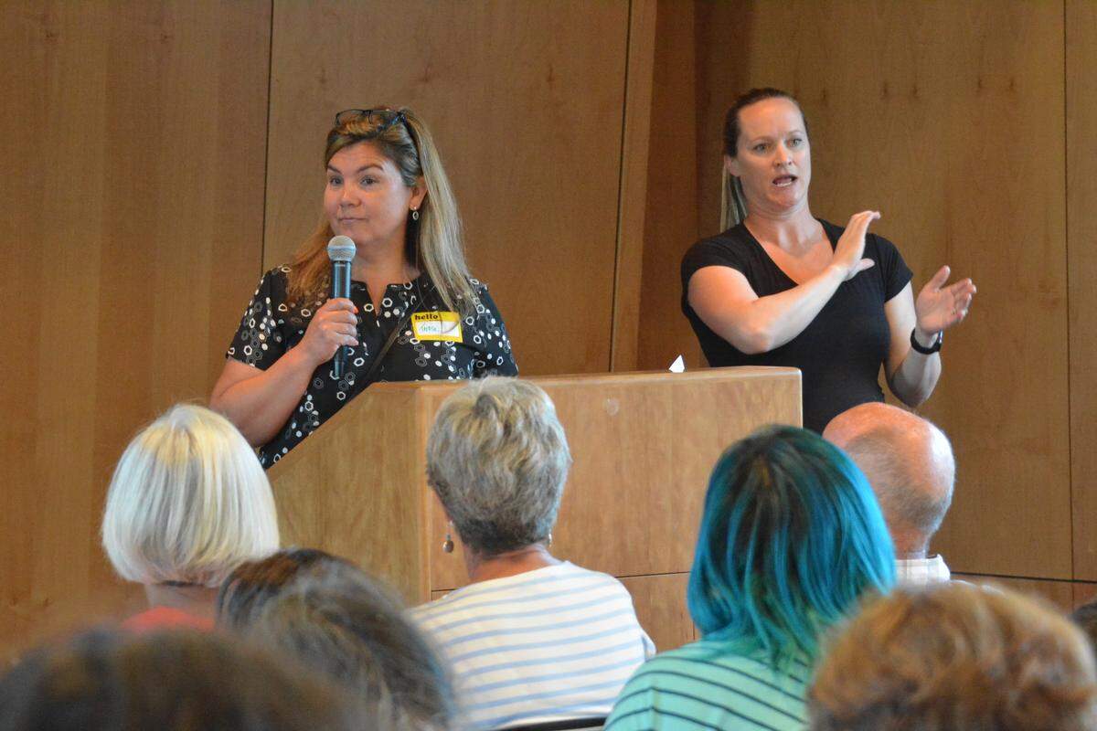 Teresa Taylor, left, a member of the Ferndale City Council, speaks during the “Not in Our Community!” meeting held Tuesday, Aug. 27, 2019, in the Ferndale (Wash.) Library.