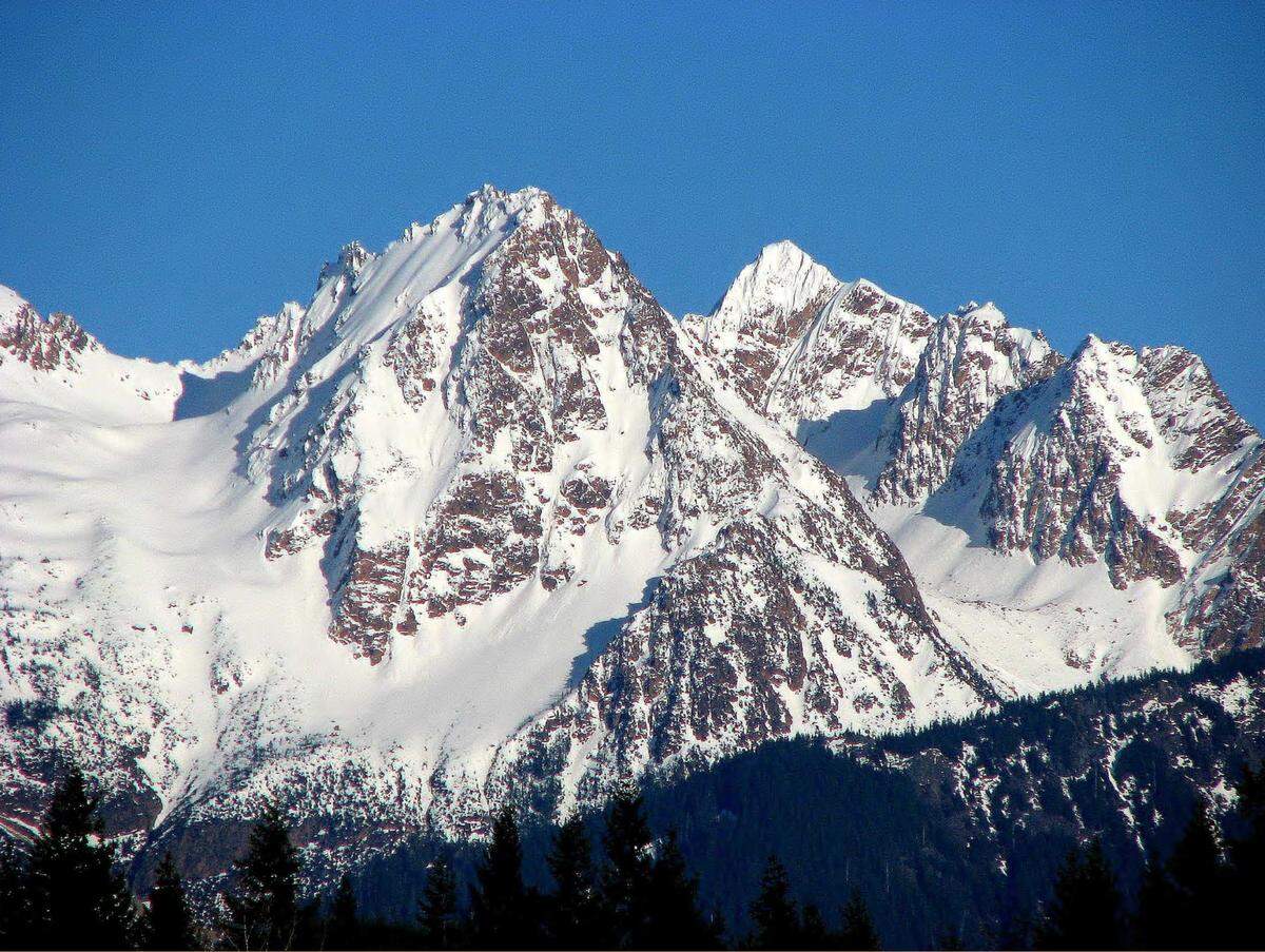 A peak in Whatcom County’s Twin Sisters mountain range that reportedly did not have a previous name will now be known as Kloke Peak in honor of the first man on record to summit it.