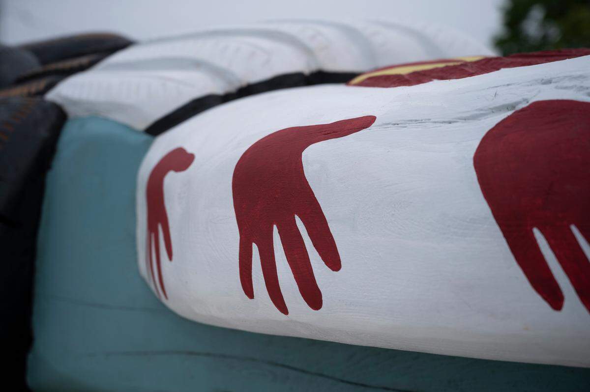 A detail on Jewell James’ totem pole, on display during a small ceremony on Wednesday, May 5, in Ferndale features red hands that call attention to missing and murdered Indigenous women and girls.