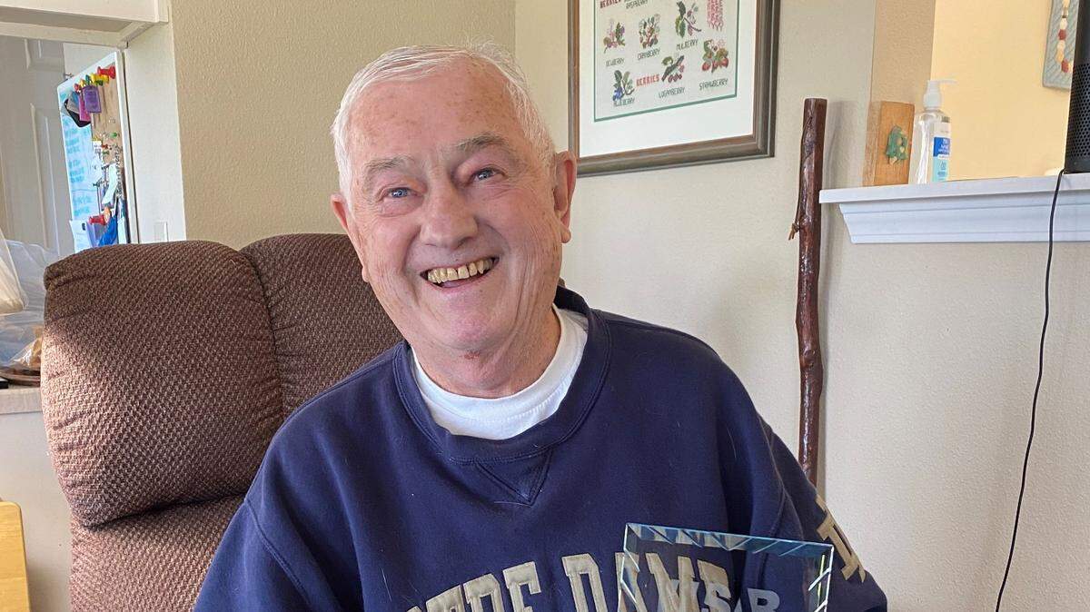 Dick Stark receives his Washington State Association of Broadcasters Hall of Fame Award at his home in Bellingham on May 10.