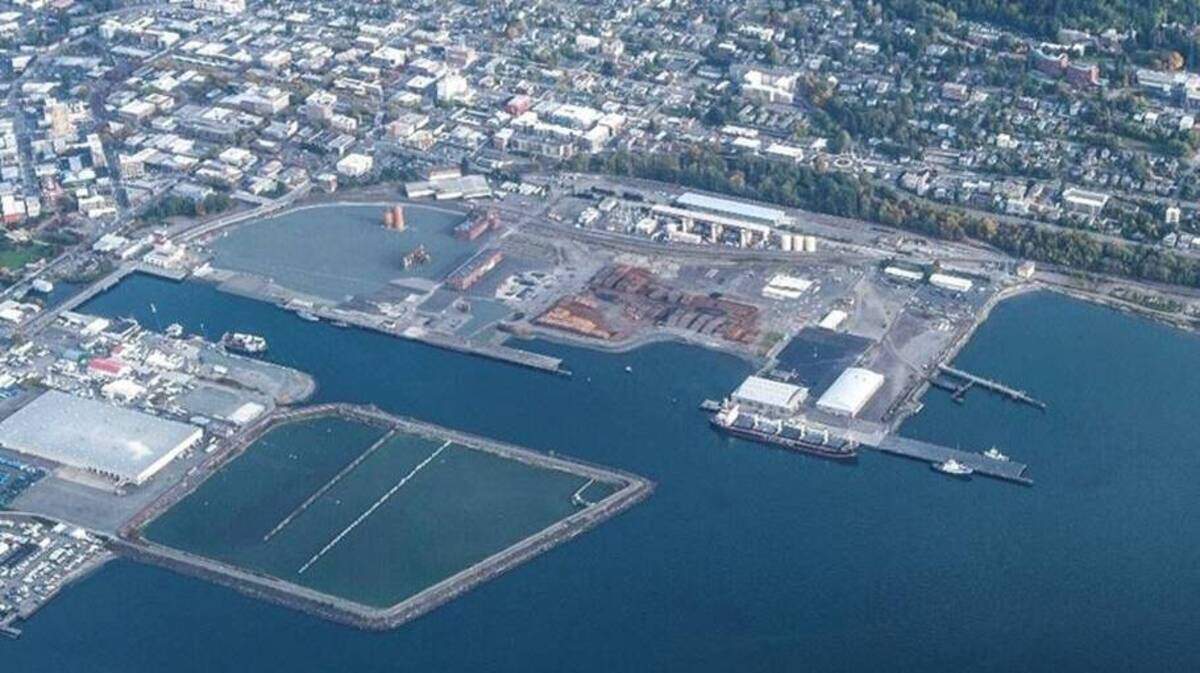 The Georgia-Pacific West cleanup site on the Bellingham waterfront in October 2017. The stabilization basin is in the foreground. Behind it is the pulp and tissue mill area, with a few industrial tanks still standing, where cleanup was completed in 2016. The Granary building and Waypoint Park have been developed there along the Whatcom Waterway. The Port of Bellingham bought the approximately 74-acre site in 2005 from Georgia-Pacific Corporation, which operated a pulp and tissue mill at the site from 1926 to 2007.