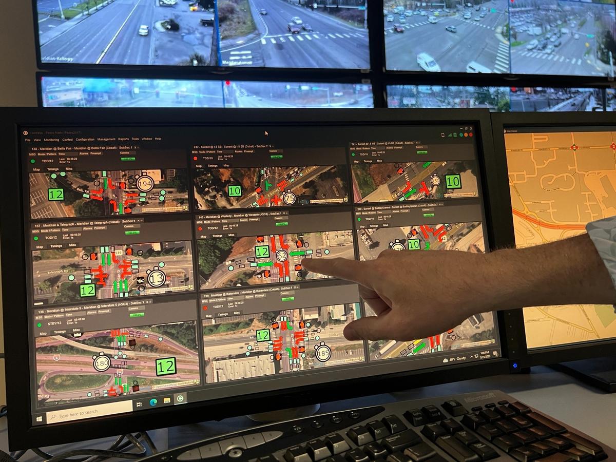 Steve Haugen, superintendent of traffic, parking and fiber for the Bellingham Public Works Department, shows a screen that monitors traffic signals inside the city’s traffic-control center on Thursday, March 23, in Bellingham.