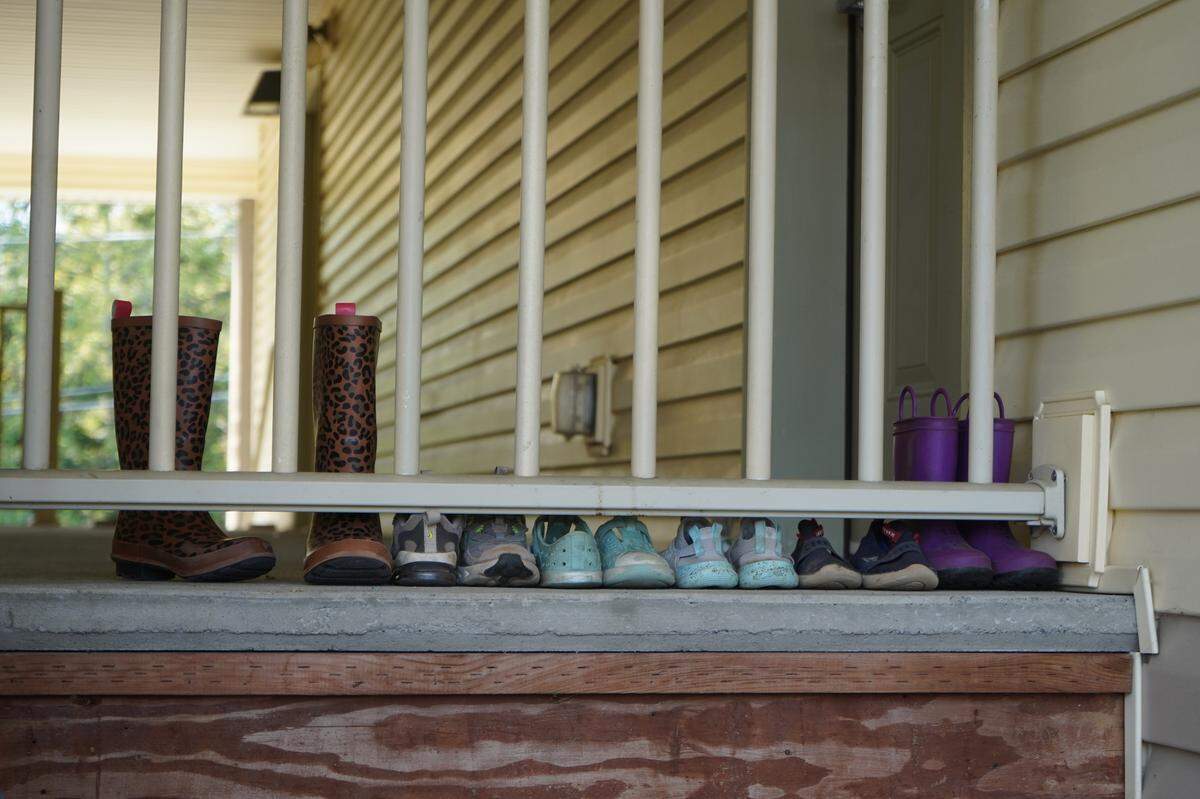 Shoes are lined up outside a residence at the Meadow Wood Townhomes on Sept. 22, in Bellingham, Washington. Residents say there is a strong community at the housing complex.