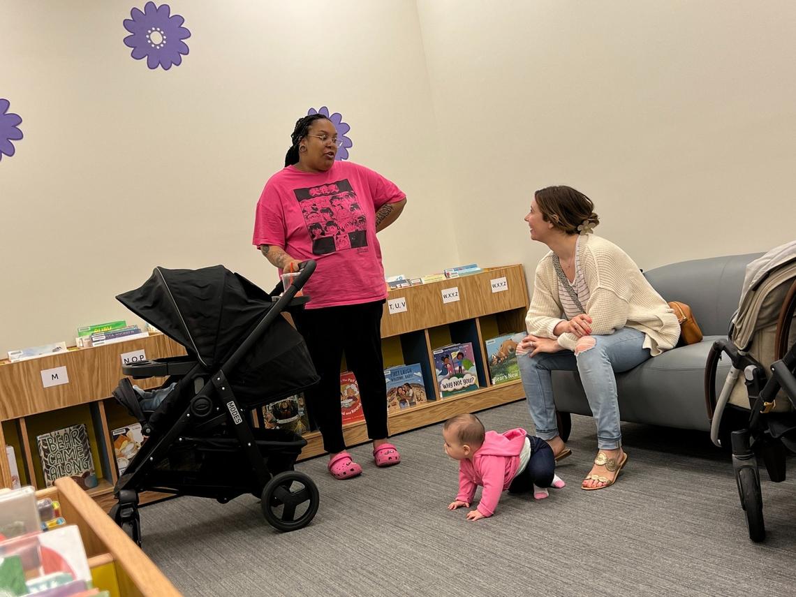 Gabbie Brown, left, and Amanda Hahn chat in the children’s area of the Bellingham Public Library’s new branch at Bellis Fair mall on Wednesday, April 26.