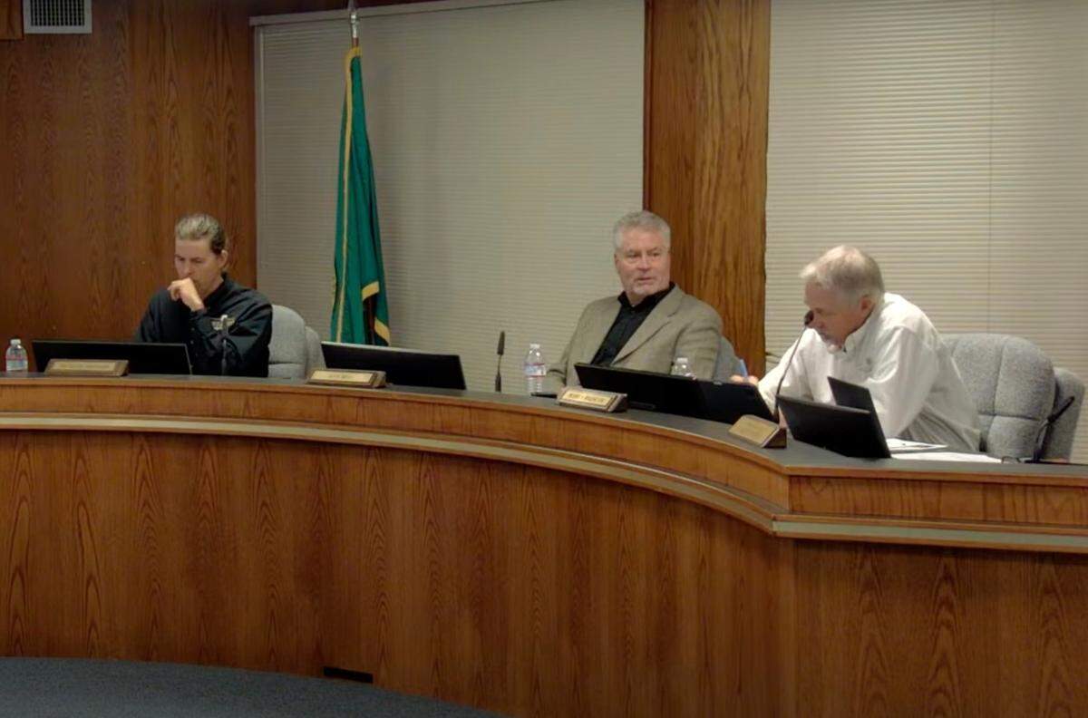 Bellingham Port Commissioners Michael Shepard (left), Ken Bell, and Bobby Briscoe discuss the possibility of holding a community forum to talk about increasing the number of commissioners on Sept. 17, 2024, in Bellingham, Wash.