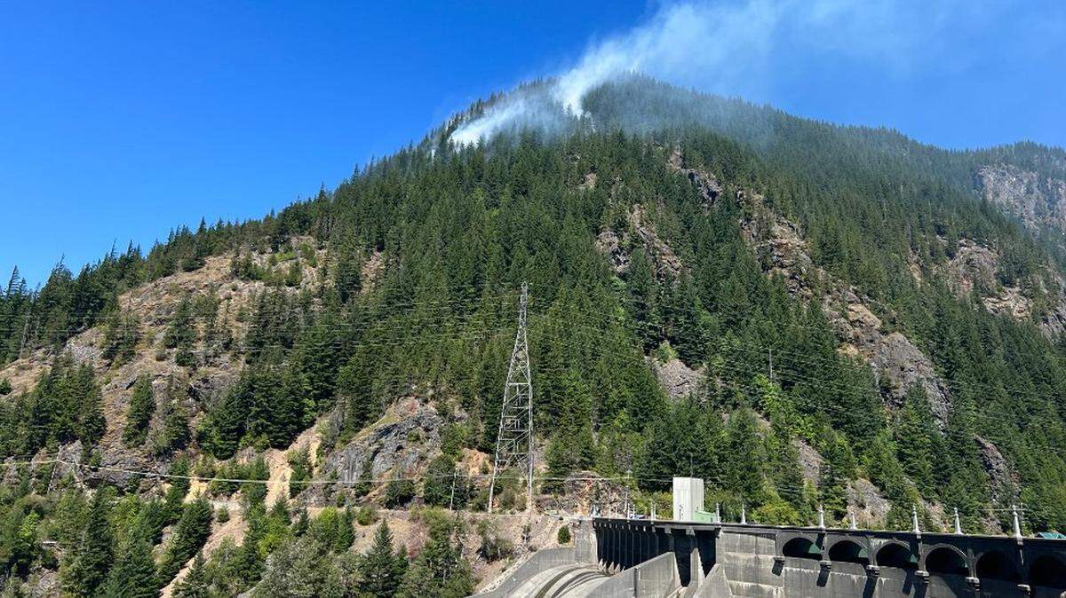 The Sourdough fire continues to burn slowly downhill toward Diablo and a hydroelectric power plant. Burning debris is rolling downhill and causing small fires ahead of the main fire, officials said Wednesday.